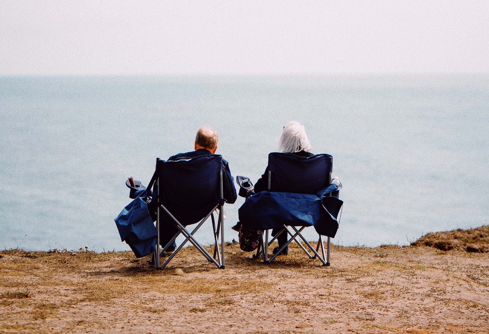 two senior people at the beach