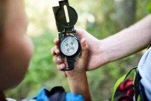 young boy with a compass