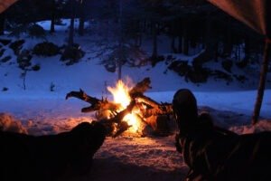 relaxing by a campfire