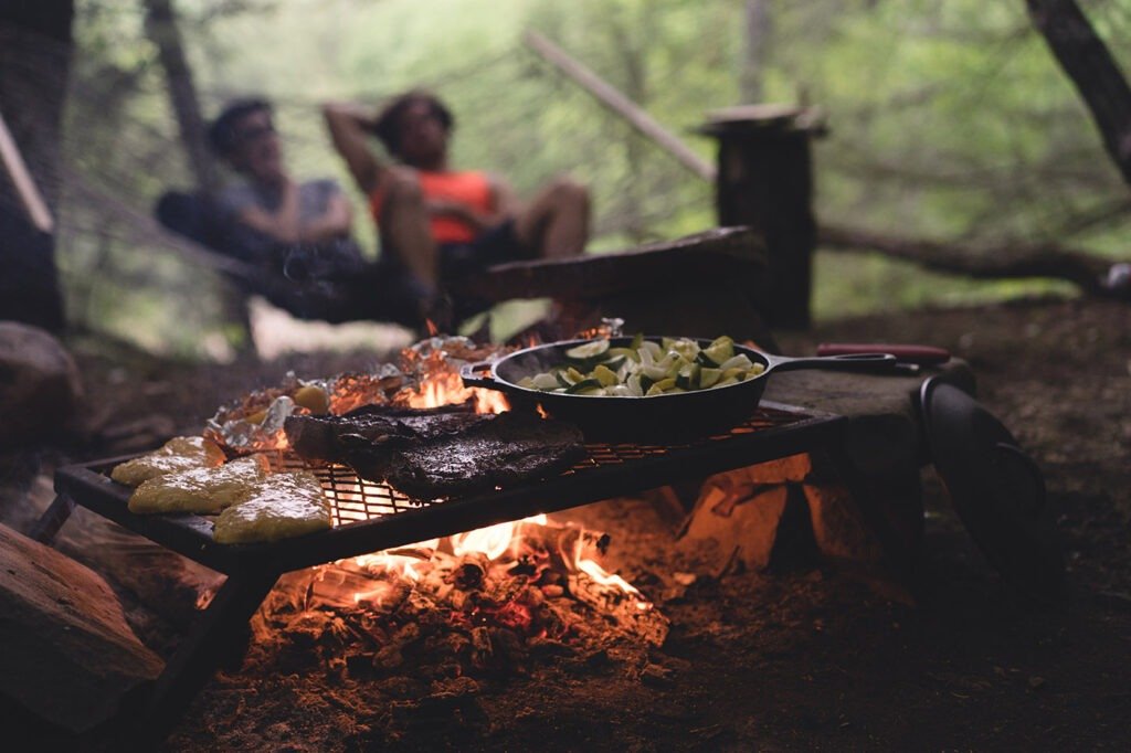 cooking on a grill over an open fire