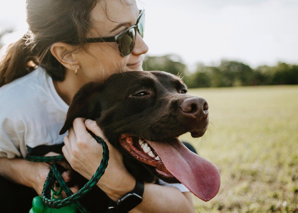 woman holding her dog